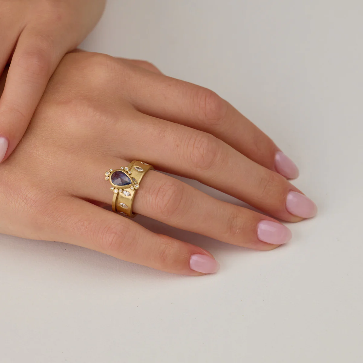 Blue Sapphire Teardrop Ring with Diamond Trios - Image 4