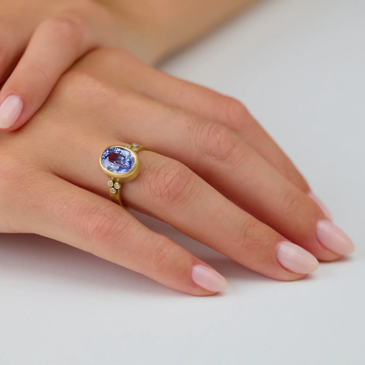 Oval Sapphire Ring with Diamond Trios - Image 2