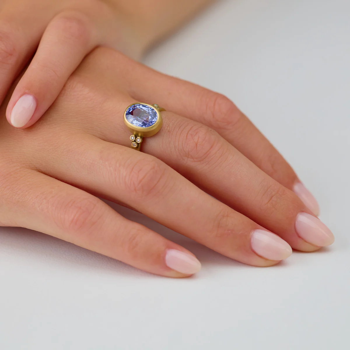 Oval Sapphire Ring with Diamond Trios - Image 4