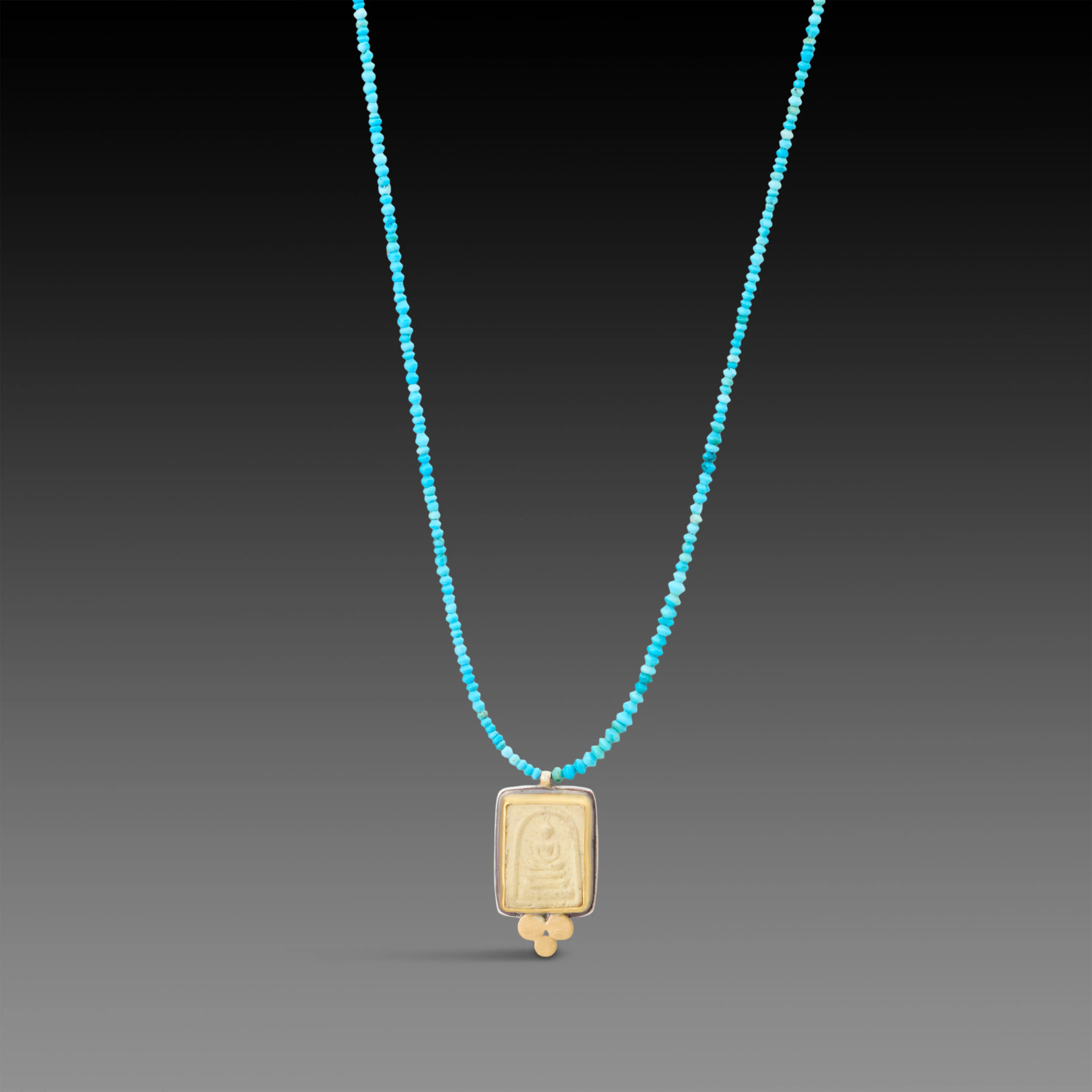 Buddha Amulet on Turquoise Strand